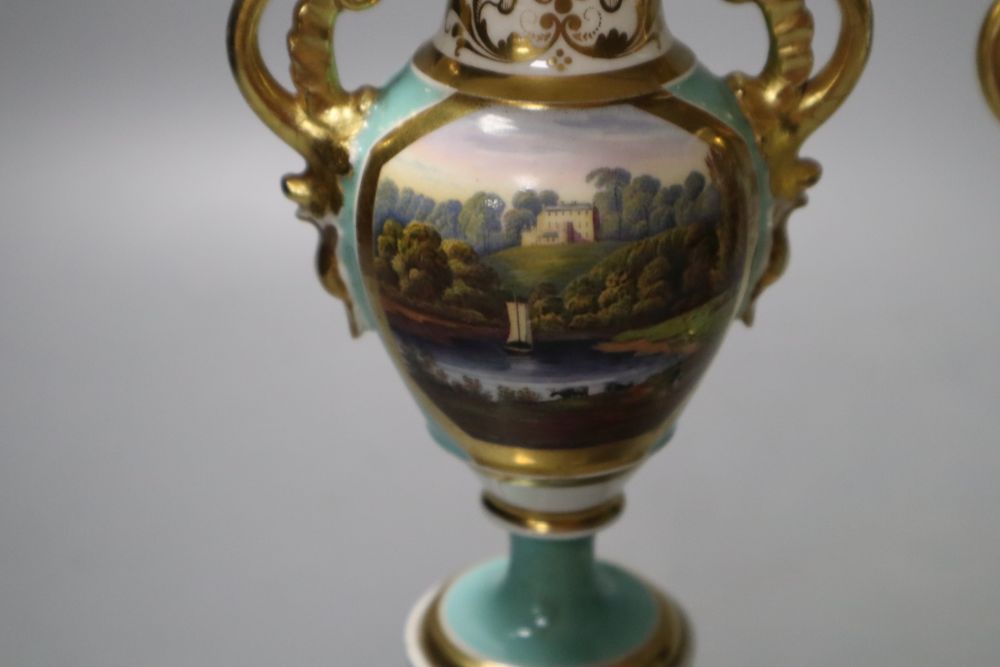 A pair of Grainger Worcester two handled vases painted with named landscapes on a sea-green ground, 17.5cm